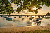 View of boats on the water in Grand Bay at golden hour, Mauritius, Indian Ocean, Africa