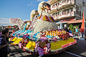 Float with large flower swans at the annual Tomohon International Flower Festival parade in city that is the heart of national floriculture, Tomohon, North Sulawesi, Indonesia, Southeast Asia, Asia