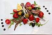 Food Plate of Marinated and Salted Anchovies with Cherry Tomatoes, Olives, Stuffed Miniature Bell Peppers, Pula, Croatia, Europe