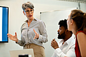 Female business manager doing a presentation during meeting