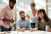 Financial team analyzing data during project meeting