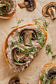 Sandwiches with mushroom pâté and mushrooms on kraft paper