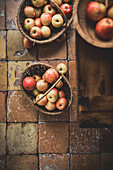 Ripe apples in a basket in a kitchen