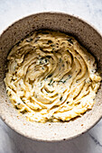 Homemade garlic butter is prepared in a bowl