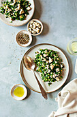 Parsley and barley salad with marinated feta on a blue background
