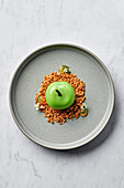 Dessert of green apples, served with salted oat crumble and apple gel