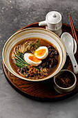 Ramen asian Noodle in broth with Beef tongue meat, Mushroom and Egg in bowl