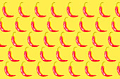 Chilischoten-Muster auf gelbem Hintergrund