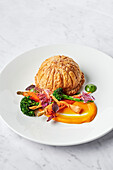 Puff pastry pithivier served with carrot puree, charred broccolini, baby carrots & salsa verde