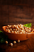 Bowl of cooked pulses rich in fibre and protein, chickpeas. Negative copy space