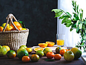 Harvest basket with oranges, lemons and tangerines on a rustic table