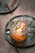 Old fashioned cocktail in a tumbler with bitters, whiskey and sugar