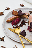 Duck balsamic pearls with beetroot puree and beetroot crisps