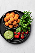 Tomato, basil and cheese arancini with green goddess aioli from above