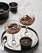 Two glasses of chocolate tofu peanut butter mousse