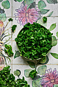 Kale on a plate on floral background