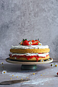 Victoria sponge cake, decorated with sliced strawberries