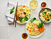 Salad ramen - vegetarian dish with egg noodles, mango, lime and vegetables. Healthy panasian cuisine