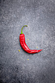 A chilli pepper on a grey background