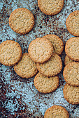 Home-baked biscuits on a blue speckled background