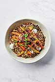 Carrots roasted with caraway seeds and honey, lentils, ancient grains, crispy puffed quinoa, lemon coconut yoghurt, roasted pepitas