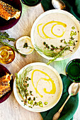 Purple Potato Fennel Bisque on a white table