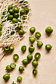 Kiwi Berries on Beige Background with Cloth Bag