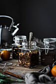 A group of rustic loose leaf teas with winter ingredients.