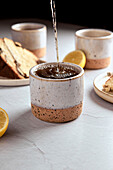 Black tea with lemon in small ceramic cups