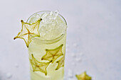 Starfruit cocktail drink with ice