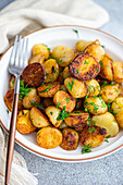 Roasted spring potato with fresh dill cabbage and raw vegetable salad served in a bowl