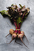Bunch of beetroots over gray background