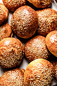 Fresh homemade brioche buns with sesame seed topping