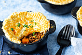 Beef pot pies in a black bowl