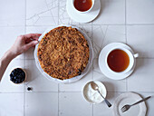 Flat image of a blueberry tart with cream