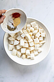Turnip cubes in a white bowl
