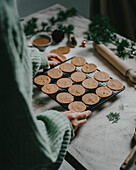 Baking Christmas almond butter biscuits with candlelight in an atmospheric style