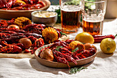 Crawfish party, cooked Louisiana, with corn on the cob, potatoes. Crawfish cooked in Cajun spices and herbs.with beer, New Orleans, Classic Cajun or Creole cuisine