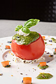 Stuffed raw tomato with pesto and ricotta