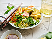 Salad ramen - vegetarian dish with egg noodles, mango, lime and vegetables. Healthy panasian cuisine