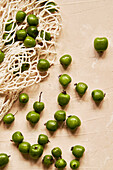 Kiwi Berries on Beige Background with Cloth Bag