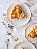 Apple pie slices on plates with forks