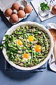 Spring vegetables stew with eggs