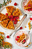 Cornflake tart being cut and served onto small plates.