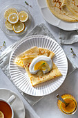 Crepes with whipped cream, lemon curd and thyme