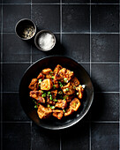 Bowl of Fried Puffy Tofu with Green Onion