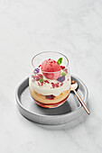 Trifle with rhubarb compote, vanilla pudding, raspberry gel, Victoria sponge cake, chantilly cream, raspberry sorbet