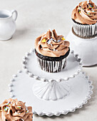 Vegan Chocolate Fig Cupcakes with Vegan Chocolate Irish Cream Frosting on Light Background