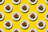 Sausages with Green peas on plate on yellow background Seamless pattern