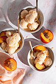 Frozen yoghurt with nectarines in three bowls